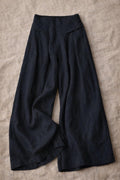 Pantalones de pierna ancha, cintura elástica con bolsillos, estilo elegante e informal.