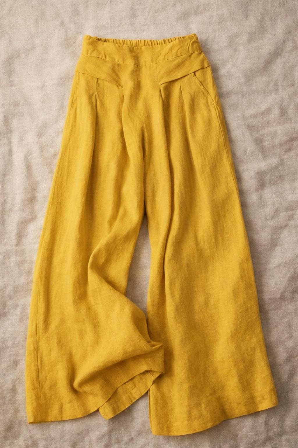 Pantalones de pierna ancha, cintura elástica con bolsillos, estilo elegante e informal.
