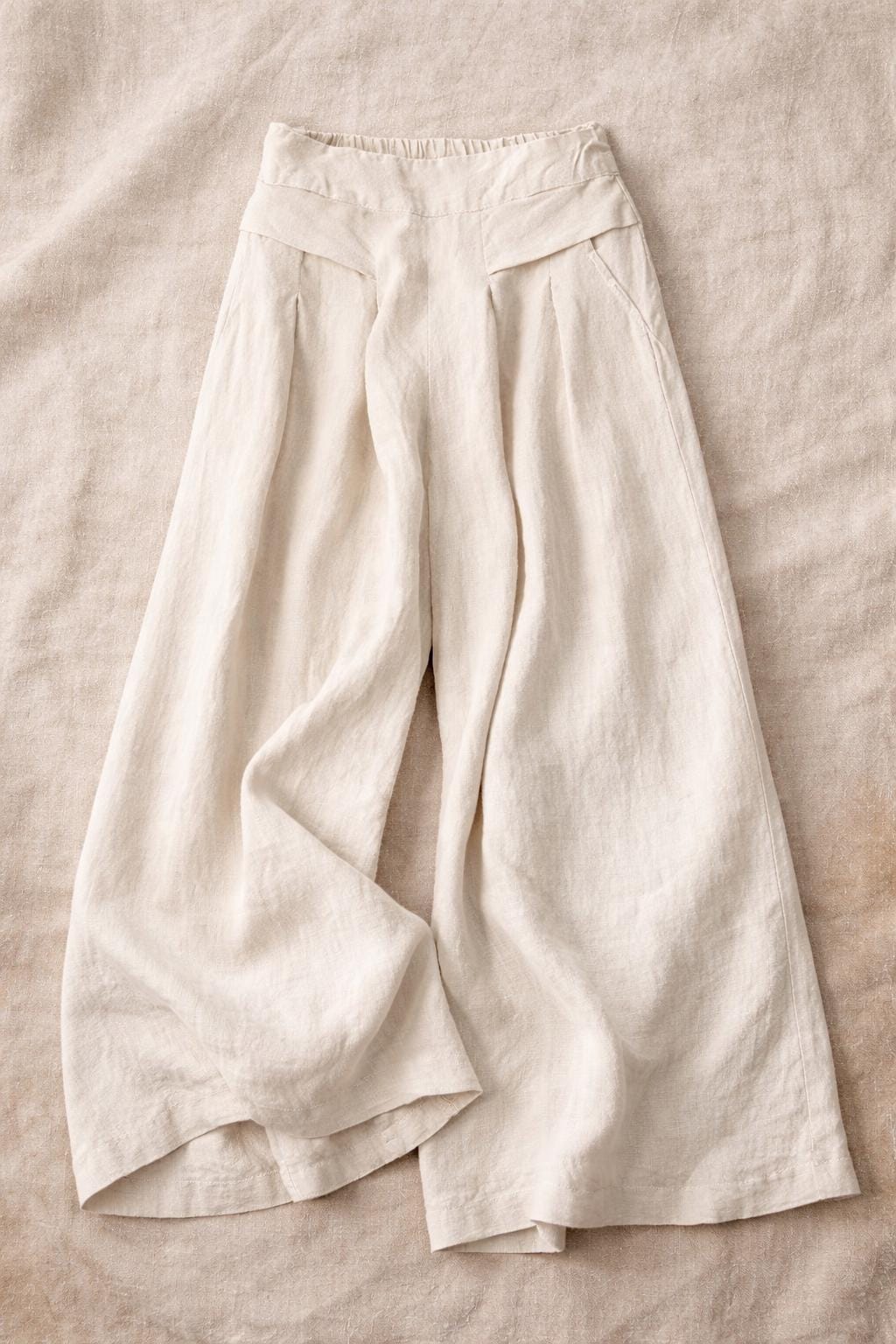 Pantalones de pierna ancha, cintura elástica con bolsillos, estilo elegante e informal.