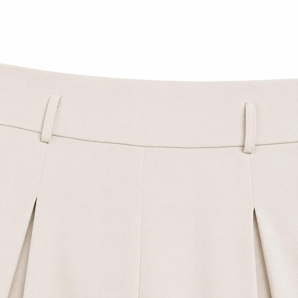 Pantalones de talle alto y pierna ancha con cintura elástica plisada.