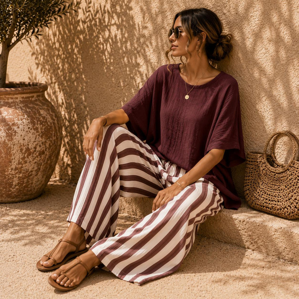 Conjunto de pantalón ancho a rayas y top de manga murciélago
